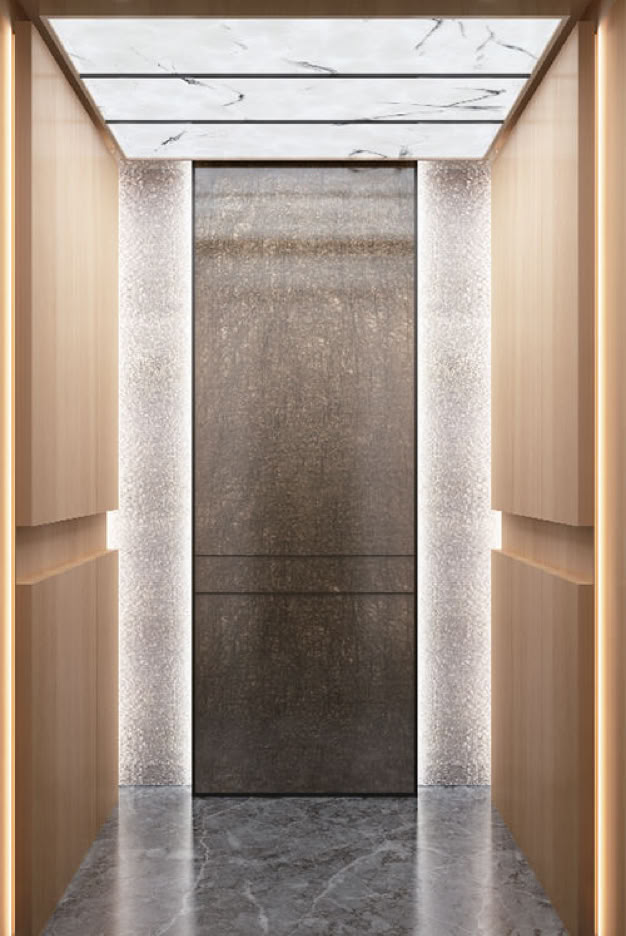Modern elevator interior with wooden panels, marble flooring, and a closed metallic door.