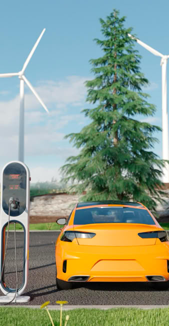 Electric car charging at a station with solar panels and wind turbines in the background.